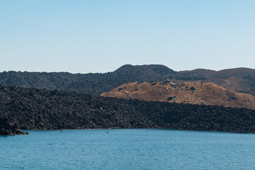 Wall Mural - Therasia island in Santorini caldera - view from boat