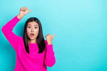 Photo of astonished lady wear pink stylish clothes two arm above head presenting special deal empty space isolated on cyan color background