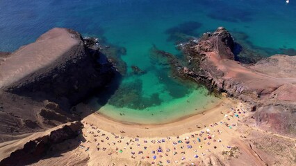 Canvas Print - Lanzarorote Canary islands beach scenery. Aerial drone video of popular scenic Papagayo beach in the south
