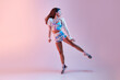 © ADDICTIVE STOCK - Fit woman dancing in studio