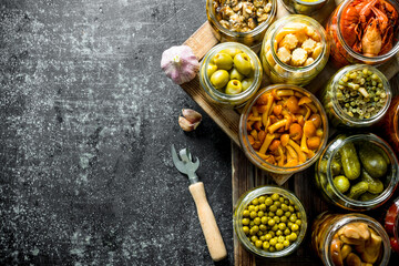 Sticker - Jars with variations of pickled food on a tray.