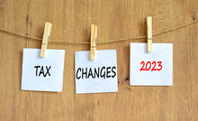 Tax Changes 2023 Symbol. Concept Words Tax Changes 2023 On White Paper On Clothespin On A Beautiful Wooden Table Wooden Background. Business Tax Changes 2023 Concept. Copy Space.