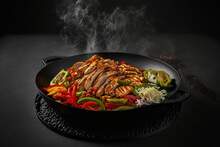 Chicken Fajitas On A Sizzling Black Plate Made By Generative Ai