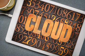 Sticker - cloud computing concept - word in vintage letterpress wood type against numbers on a digital tablet