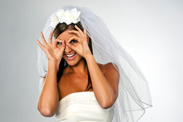 Modern Bride Wearing A White Dress Against A Plain Background