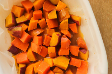 diced sweet potato baked in the oven on a baking sheet