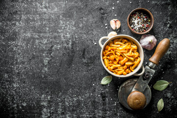 Poster - Canned mushrooms with spices, cloves of garlic and the Bay leaf.