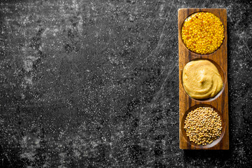 Poster - Different types of mustard in wooden stand.