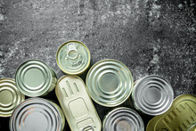 Group Of Closed Tin Cans With Canned Food.