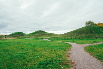 Huge ancient mounds in the countryside of Gamla Uppsala, an important religious centre. Viking burial mounds, important sacred sites in Scandinavia, sacrificial rites and fiery burials of royalty.