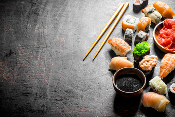 Wall Mural - Different sushi with soy sauce and chopsticks.