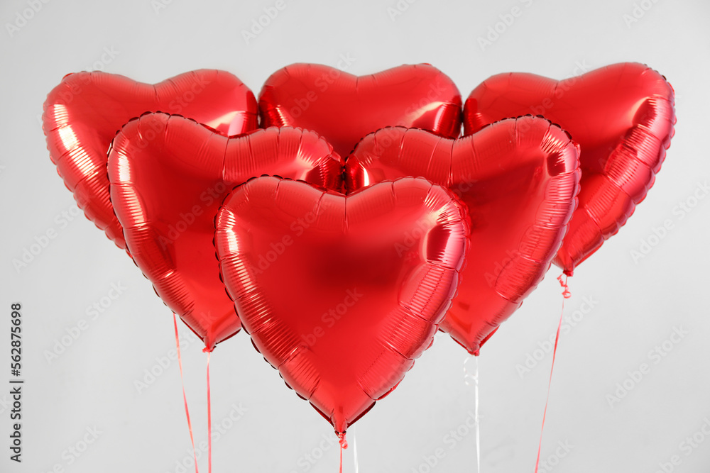 Heart shaped balloons for Valentine's Day on light background