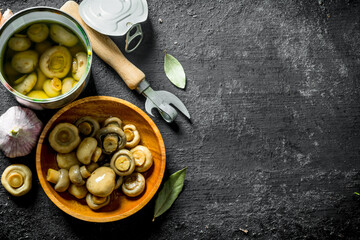 Canvas Print - Canned mushrooms with garlic and Bay leaf.