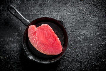 Poster - Fresh raw tuna steak in a pan.