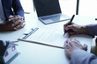 © Tj - Businessman discussing commercial real estate sector faces risks as financial.