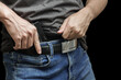 Man drawing a conceal carry pistol from a holster