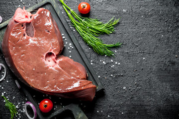 Canvas Print - Piece of fresh raw liver with greens.