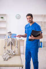 Wall Mural - Young male doctor radiologist and skeleton patient at the hospit