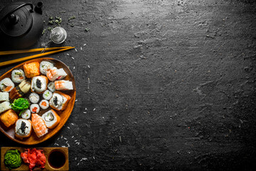 Poster - Fresh sushi and rolls with sauces and green tea.