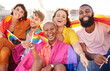 © Alexis S/peopleimages.com - Portrait, diversity and rainbow flag for lgbtq community, freedom and smile for parade, support or solidarity. Friends, group or young people with non-binary, gay and lesbian with happiness and queer