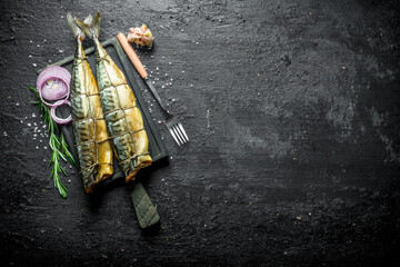 Canvas Print - Fragrant smoked mackerel with chopped onions, a sprig of rosemary and garlic.