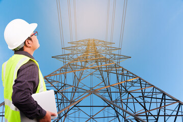 Wall Mural - large high voltage pyloEngineer inspecting high voltage transmission towers