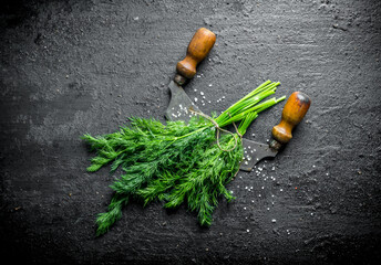 Wall Mural - Freshly cut dill with a knife.