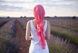 © Cavan Images - woman with pink cancer scarf in a lavender field