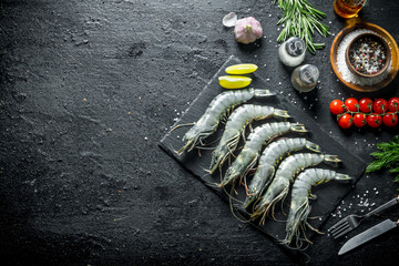 Wall Mural - Fresh raw shrimps with spices, garlic and tomatoes.