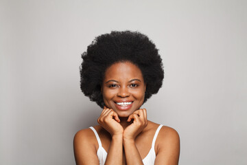 Laughing smiling model woman with dark clean fresh smooth skin portrait. Cute female face