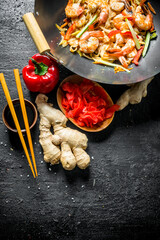 Sticker - Chinese wok. Freshly cooked Udon noodles with ginger and soy sauce in bowls.