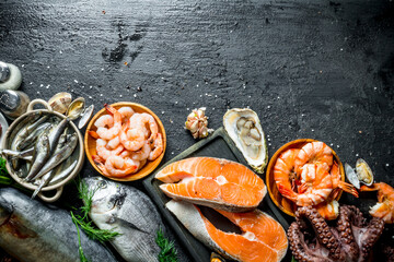 Poster - Salmon steak on a cutting Board with seafood.