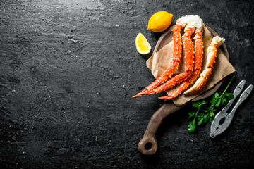 Wall Mural - Crab on a cutting Board with lemon and parsley.