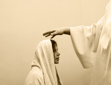 Blessing Hand Above The Head Of A Woman In A Headscarf