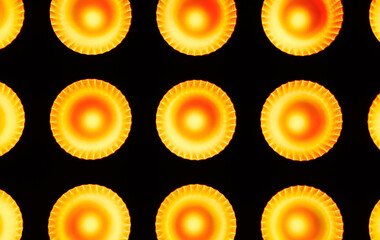 Abstract background texture. Orange and yellow round shapes like a sun in the middle of them.