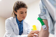 © Graphicroyalty - Friendly hospital phlebotomist collecting blood sample from patient in lab. Preparation for blood test by female doctor medical uniform on the table in white bright room