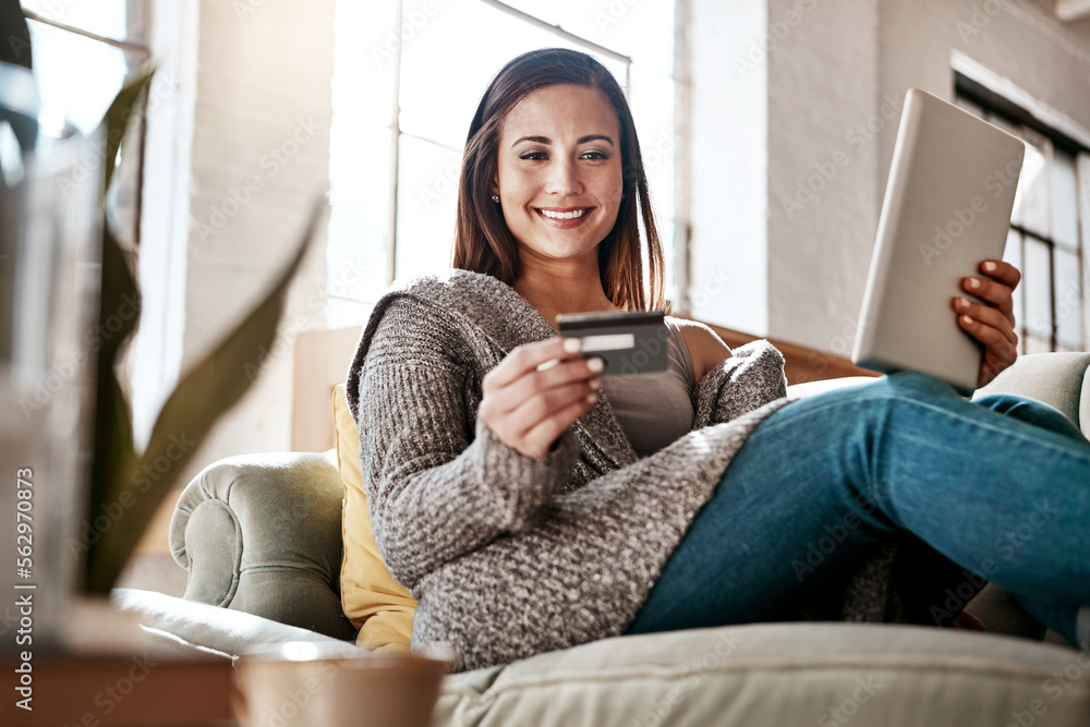 Online payment, digital tablet and credit card by woman on a sofa for ...