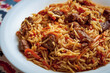 © ismishko - Classic oriental pilaf with meat and spices served on a plate