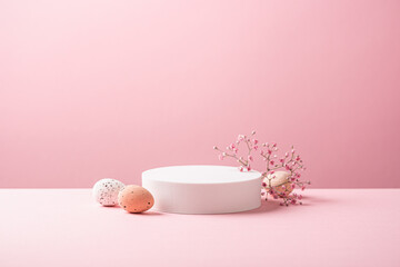 Abstract empty white podium with Easter quail eggs and spring flowers on pink background. Mock up stand for product presentation. Minimal concept. Advertising template