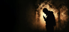 Silhouette Religious Of Muslim Male Praying In The Mosque