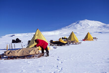 Cliff Lieght,Antartic explorer,packs up his Nansen sledge, Antarctica.