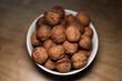 © Westlight - Walnuts, snack. Some walnuts in a bowl on the table in the kitchen.