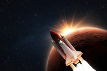 New Space Shuttle Rocket Successfully Flies To The Red Planet Mars At Sunset In Starry Space. Spacecraft Launch And Space Mission To Mars At Sunset