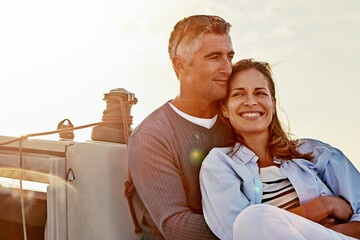 Travel, investment and luxury with couple on yacht for success, relax and wealth on retirement trip. Travel, love and ship hobby with baby boomers man and woman sailing on boat for tropical vacation