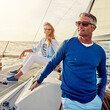 © Grady R/peopleimages.com - Mature, happy couple or retirement sailing yacht on ocean, sea or water relax holiday, wealth vacation or success summer. Smile, man or woman on luxury boat in investment, travel or freedom adventure