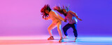 Music. Young expressive hip-hop dancers dancing in neon. Concept of dance, youth, hobby, dynamics, movement, action, ad. Banner