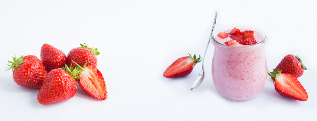 Wall Mural - Natural milk yogurt with strawberry in the glass jar on the white background. Copy space. Banner.