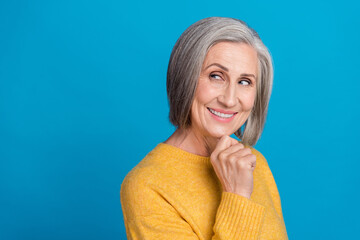 Poster - Photo portrait of mature lovely lady intelligent look empty space create plan wear trendy yellow outfit isolated on blue color background