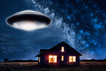 Big Flying Sourcer Ufo With Warm White Lights And Glowing Engine At Bottom Flying Over Lonely House In A Field With Orange Glowing Windows And Some Star Sky In Background,generative AI