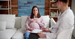 © Andrey Popov - Doula Care And Pregnant Woman Patient